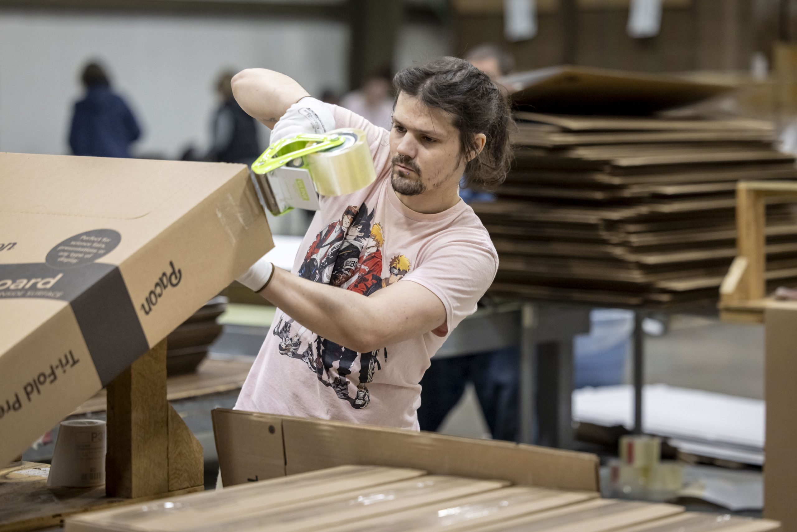 Derik Skorbier works on a project at Apricity Contract Packaging in Appleton.