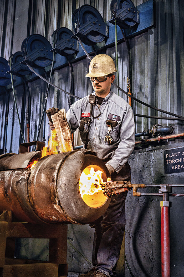 William Mork, a melt foreman at Waupaca Foundry, performs an inspection.