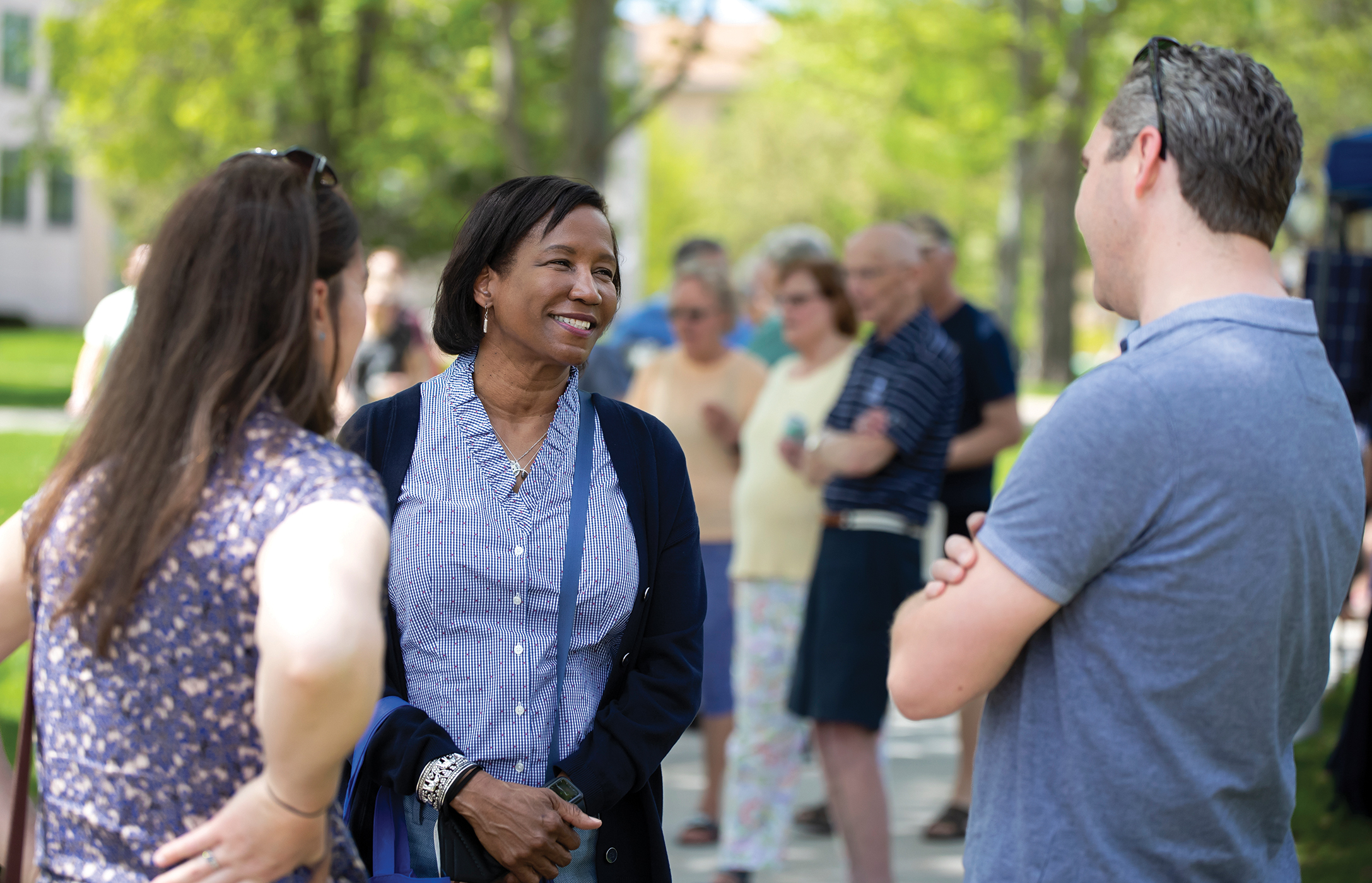 Laurie Carter speaks with guests at the university’s Brighter Together Picnic May 14. The community celebration followed Carter’s inauguration and was held in honor of Lawrence’s 175th anniversary.