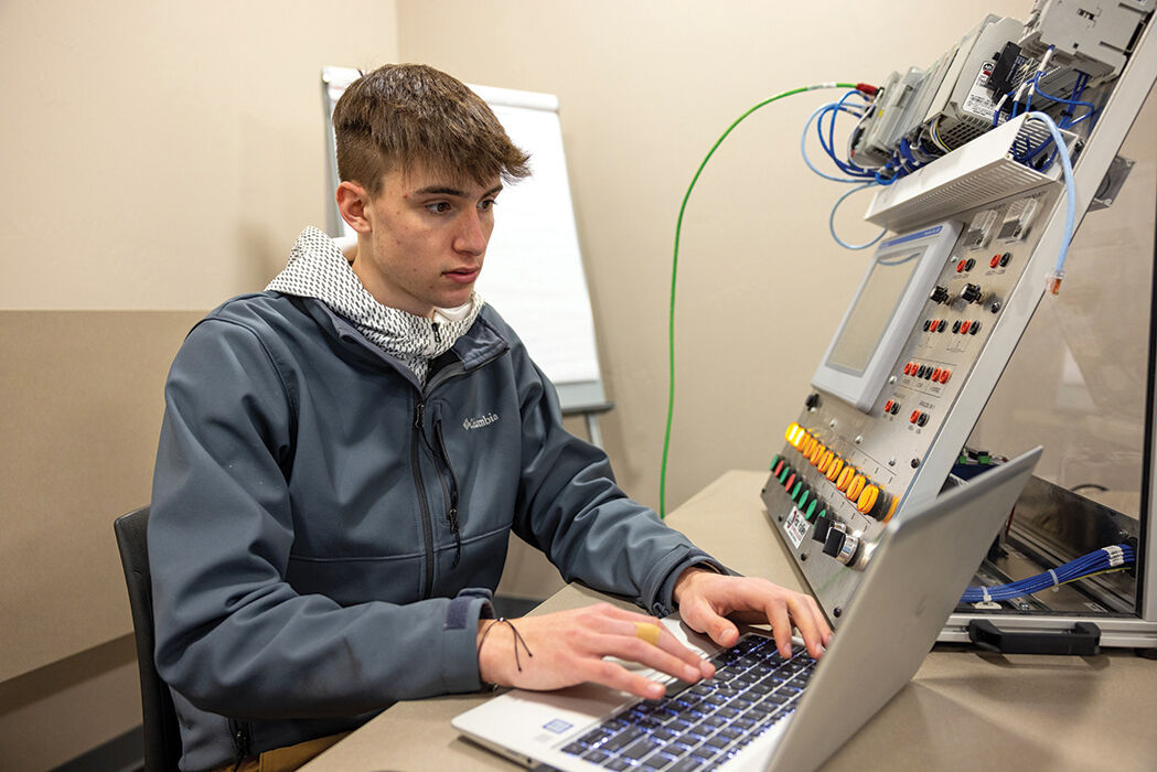Casey Ploederl troubleshoots an Allen-Bradley programmable logic controller program.