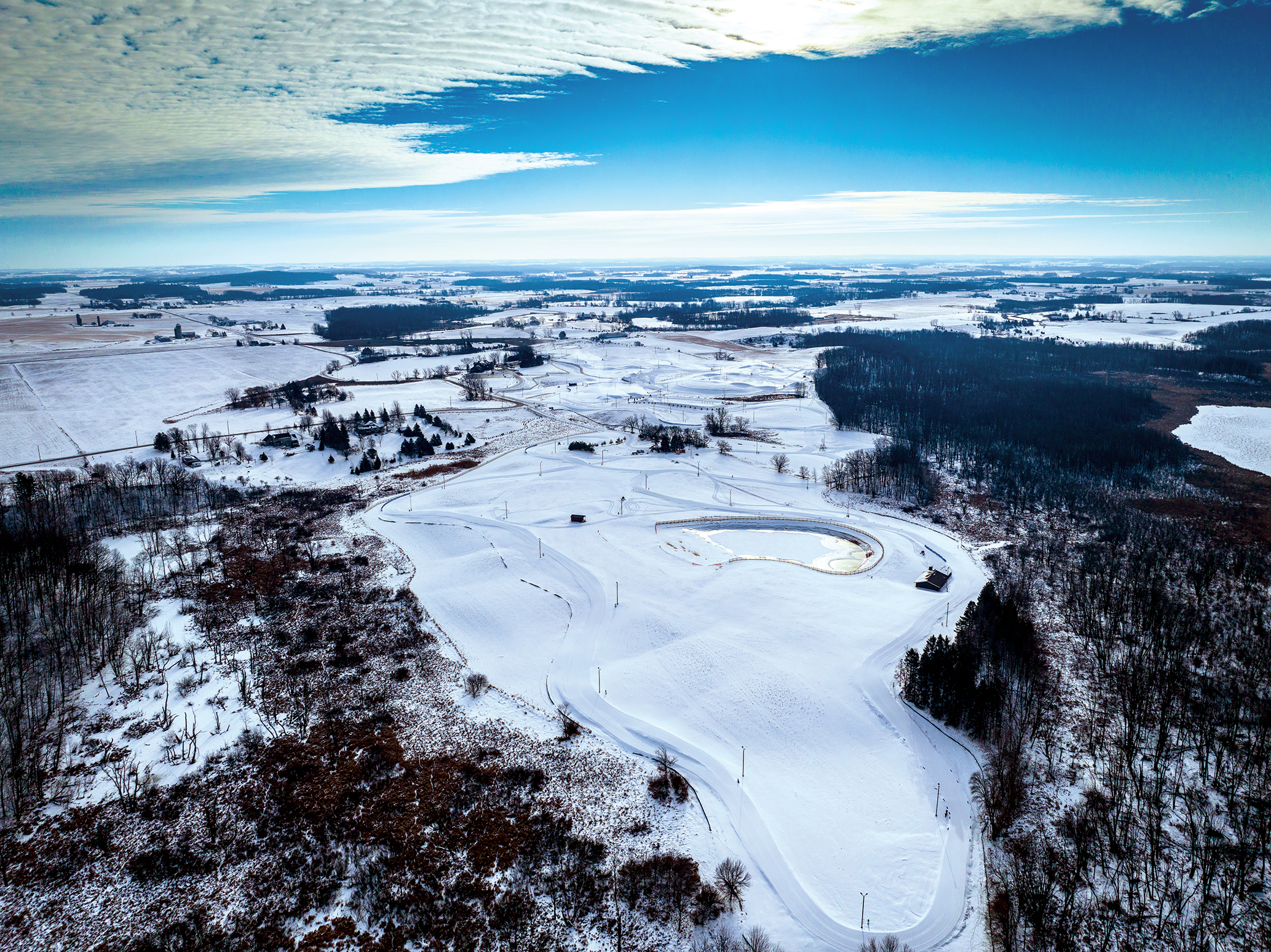 A recent addition to the recreational offerings of Calumet County is the Ariens Nordic Center, which includes five kilometers of lighted cross-country skiing trails, a 3K paved roller ski loop, and a 10-million-gallon pond for snowmaking.