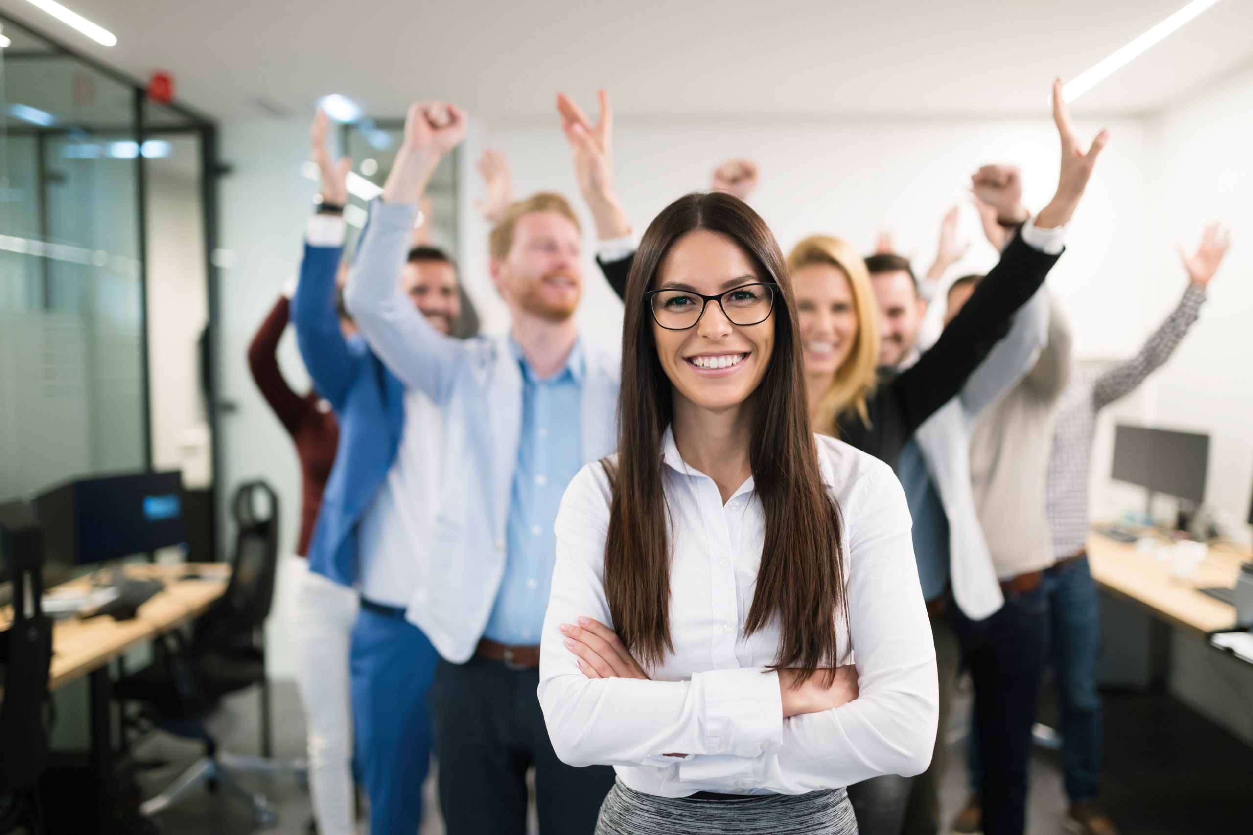 Portrait of group of successful businesspeople happy at work