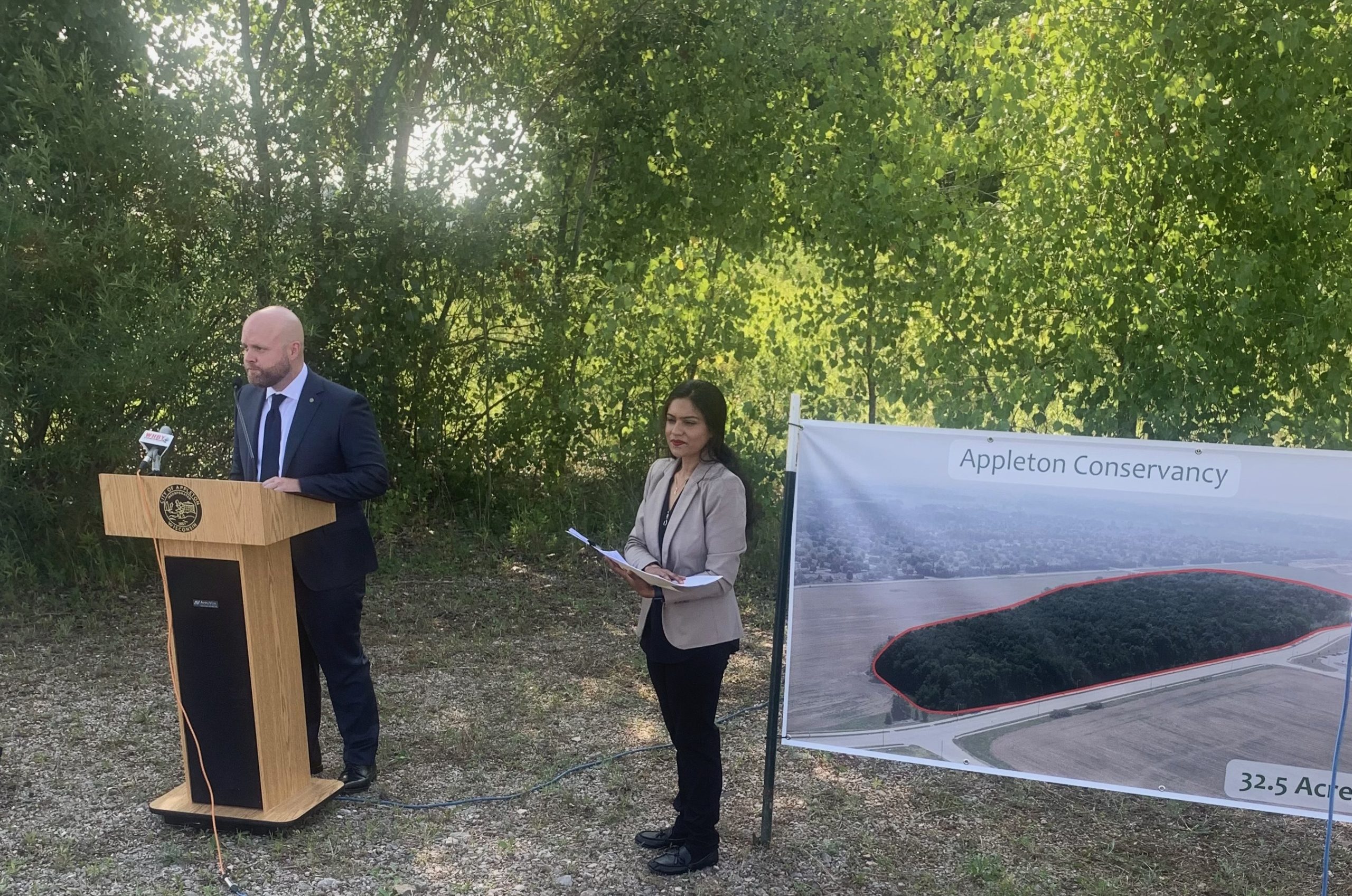 Appleton Mayor Jake Woodford address the media July 19 at the site of the new Appleton Nature Conservancy.