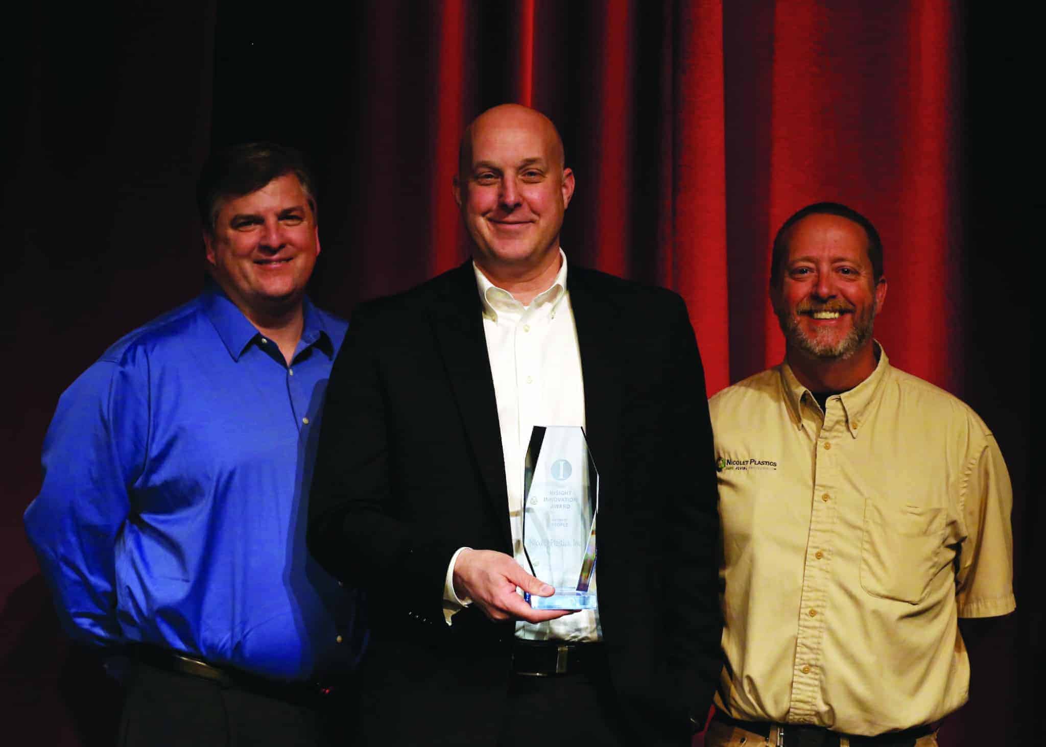 Nicolet Plastics winners with trophy