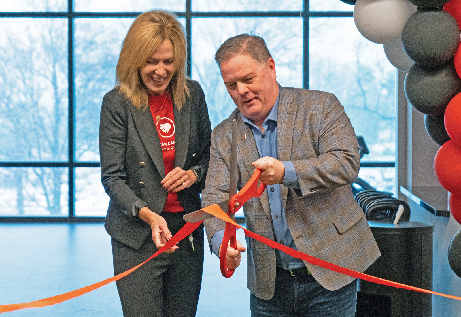 President and CEO of CCU, Laurie Butz, along with Sean Elliot, President and CEO of the Greater Green Bay YMCA, cut the ribbon at the opening of the new YMCA location at The Ridge at Capital Credit Union.