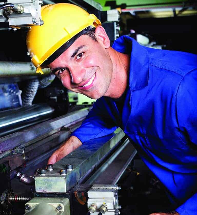 happy modern industrial machine operator at work