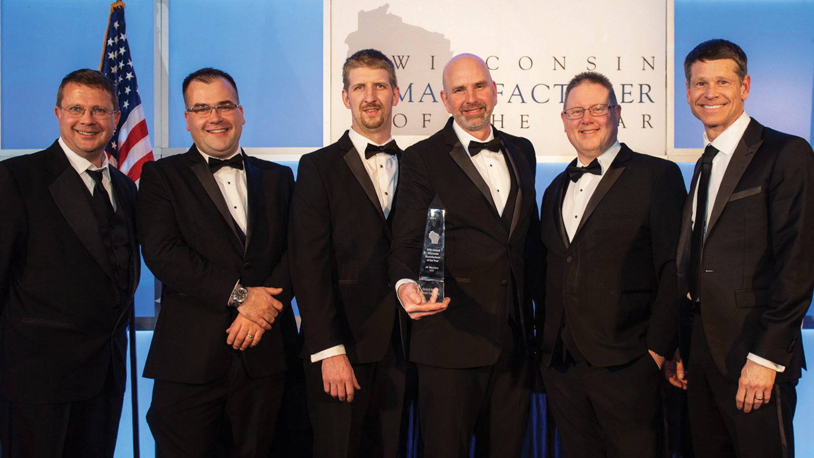 (L to R) Alex Lawton, Parker Tumanic, Shane Kunschke, Paul Knoll, Scott Schenk and Paul Schneider accept the Wisconsin Manufacturer of the Year Award on behalf of JR Machine.