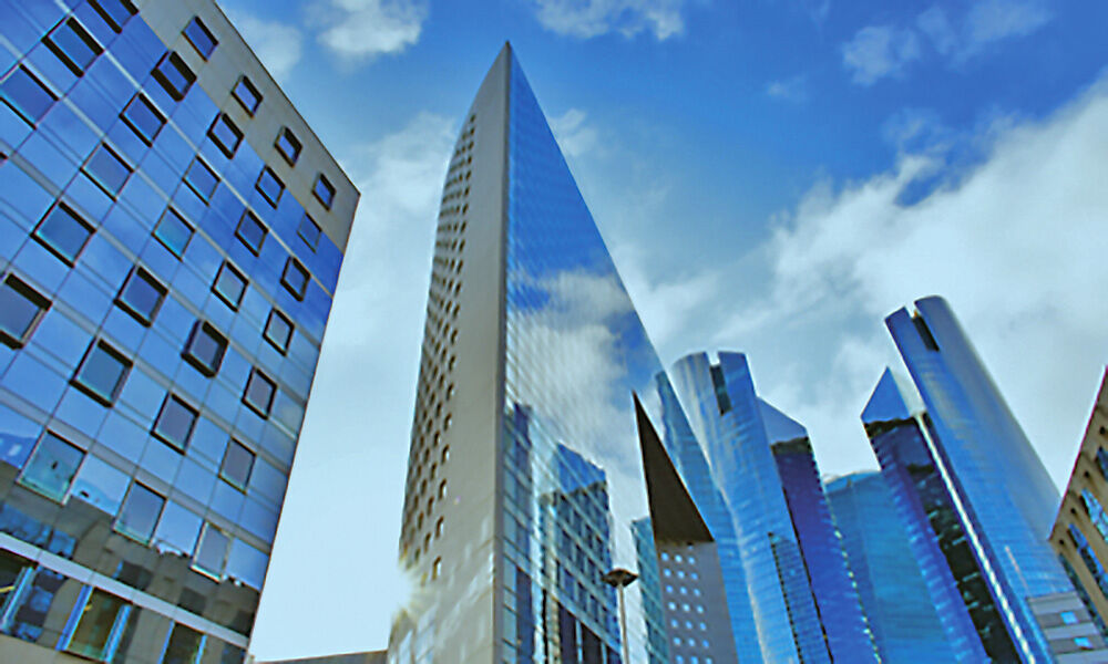 Skyscaper with cloudy blue sky