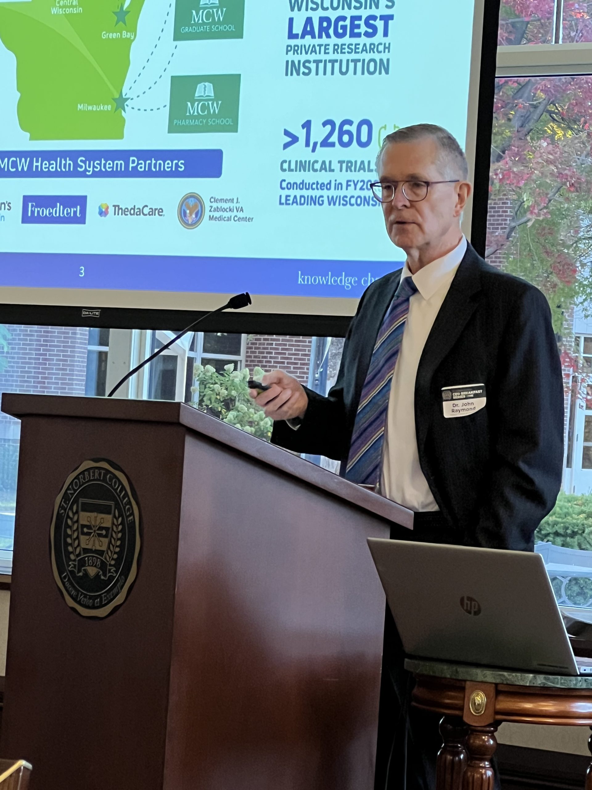 Dr. John Raymond of the Medical College of Wisconsin speaks at the St. Norbert College CEO Breakfast.