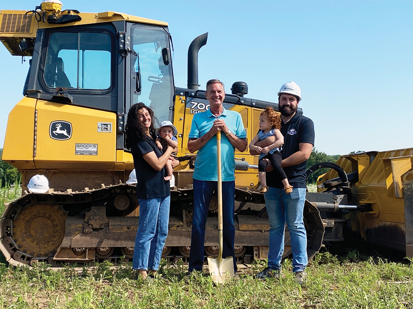 Kaleb Ranker (right), his wife Karen Vidal (left) and their children, Kenny and Katherine Ranker, break ground on KDR’s expansion with Green Lake Mayor Ray Radis (middle).