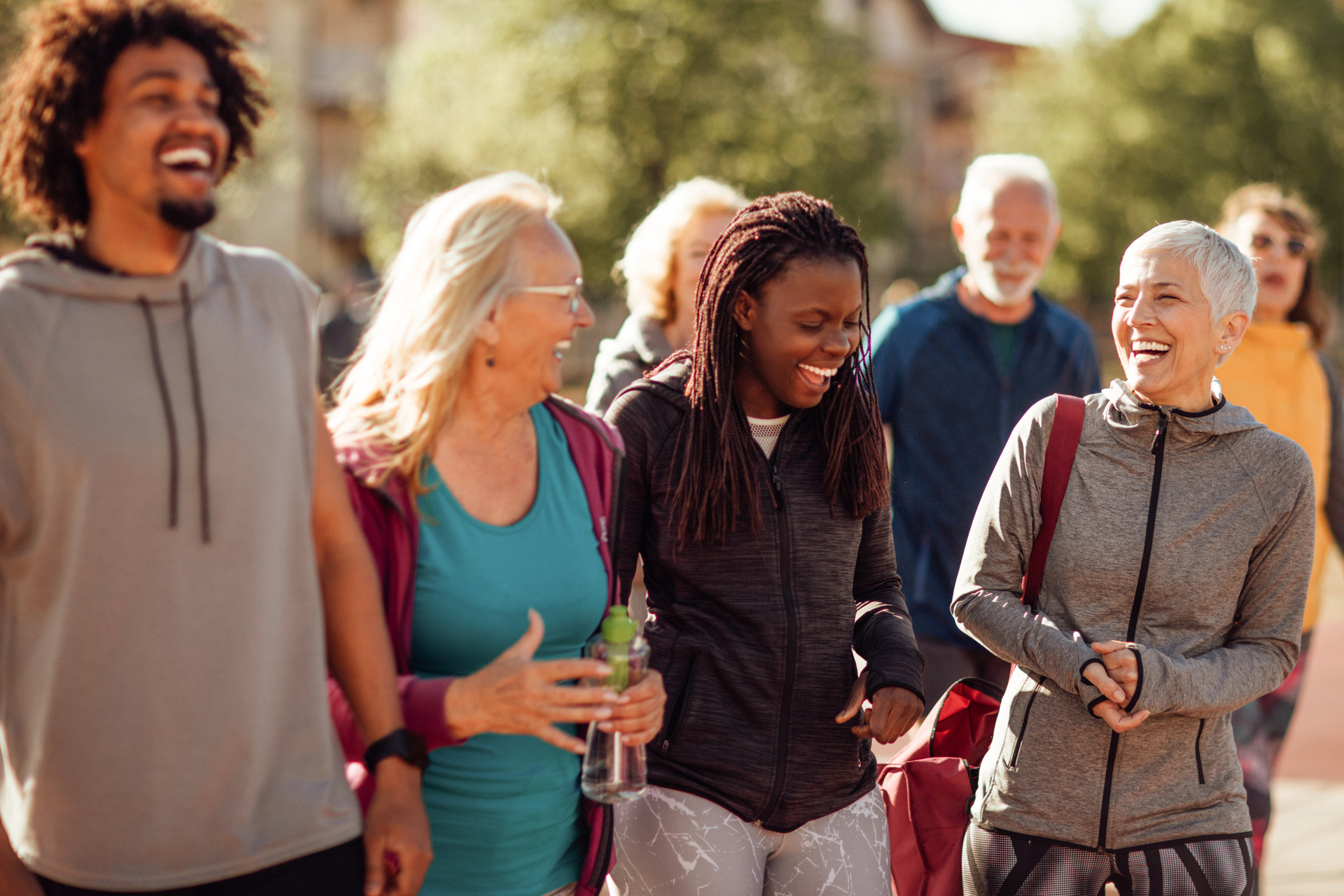 Smiling group of people walking together outdoors