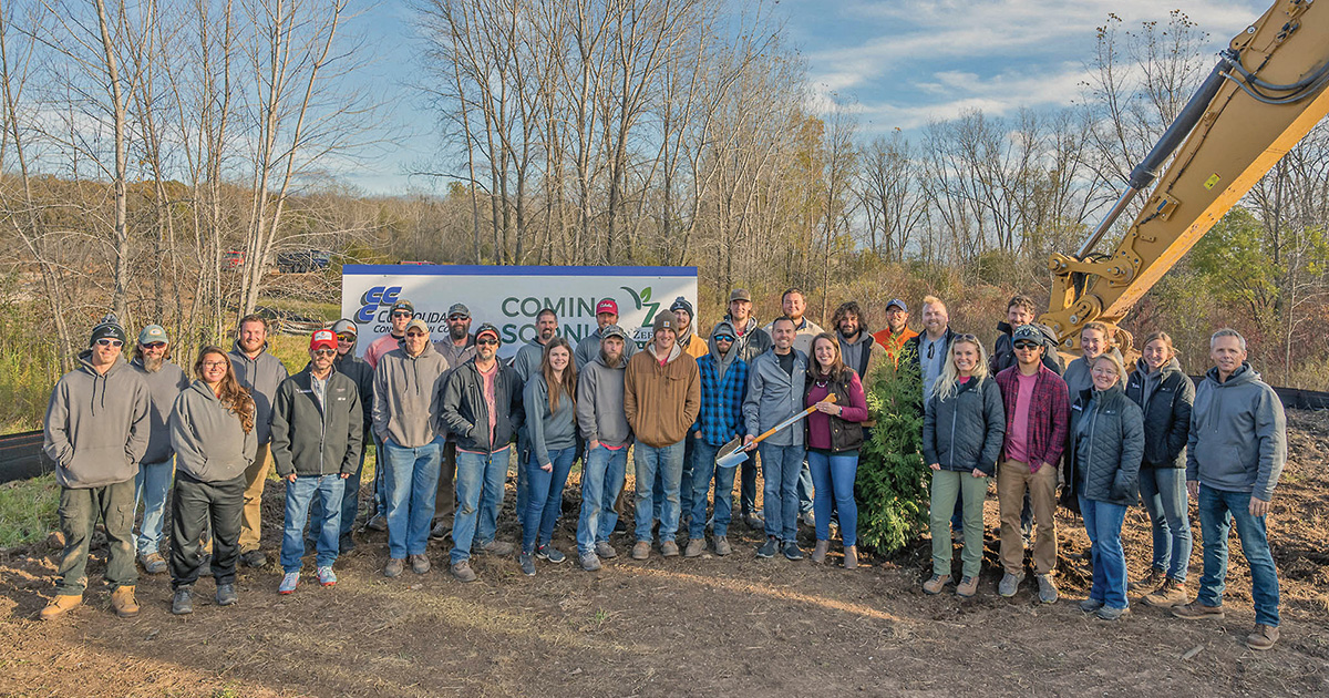 The 2021 staff of Van Zeeland Nursery & Landscape gathers after the groundbreaking ceremony of the Grand Chute location.