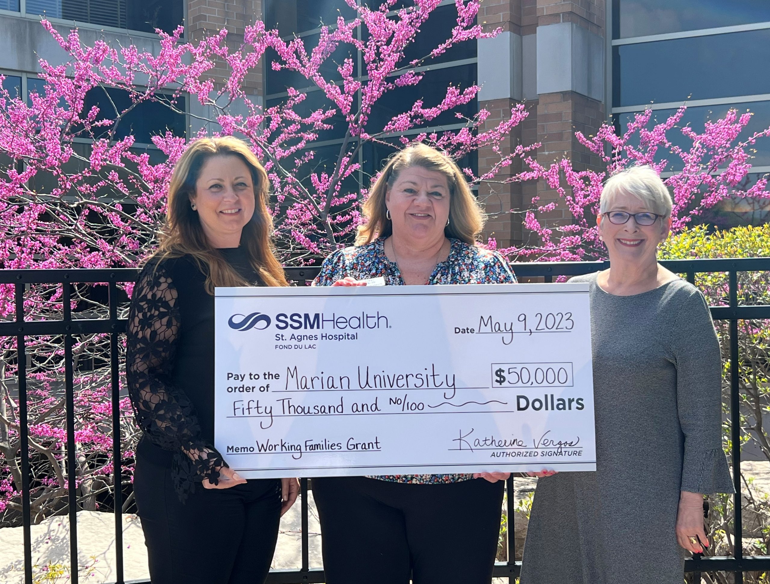 Katherine Vergos (left), president of SSM Health St. Agnes Hospital, presents a $50,000 gift to support the Marian University Working Families Grant program. The donation was received by Michelle Majewski (right), president of Marian University and Kerry Strupp (center), Marian University’s director of the Working Families Grant