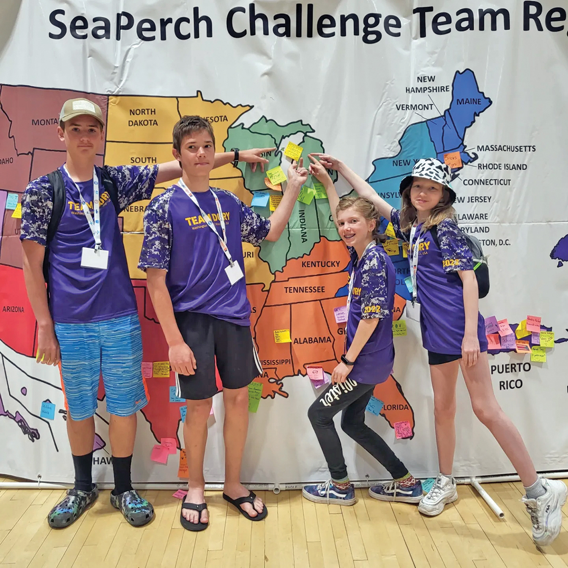 Team Dory members (l to r) Magnus Purinton, Collin Verboomen, Julia Pratt and Allison Bennett proudly show off the location of their hometown at the 2022 International SeaPerch Challenge.
