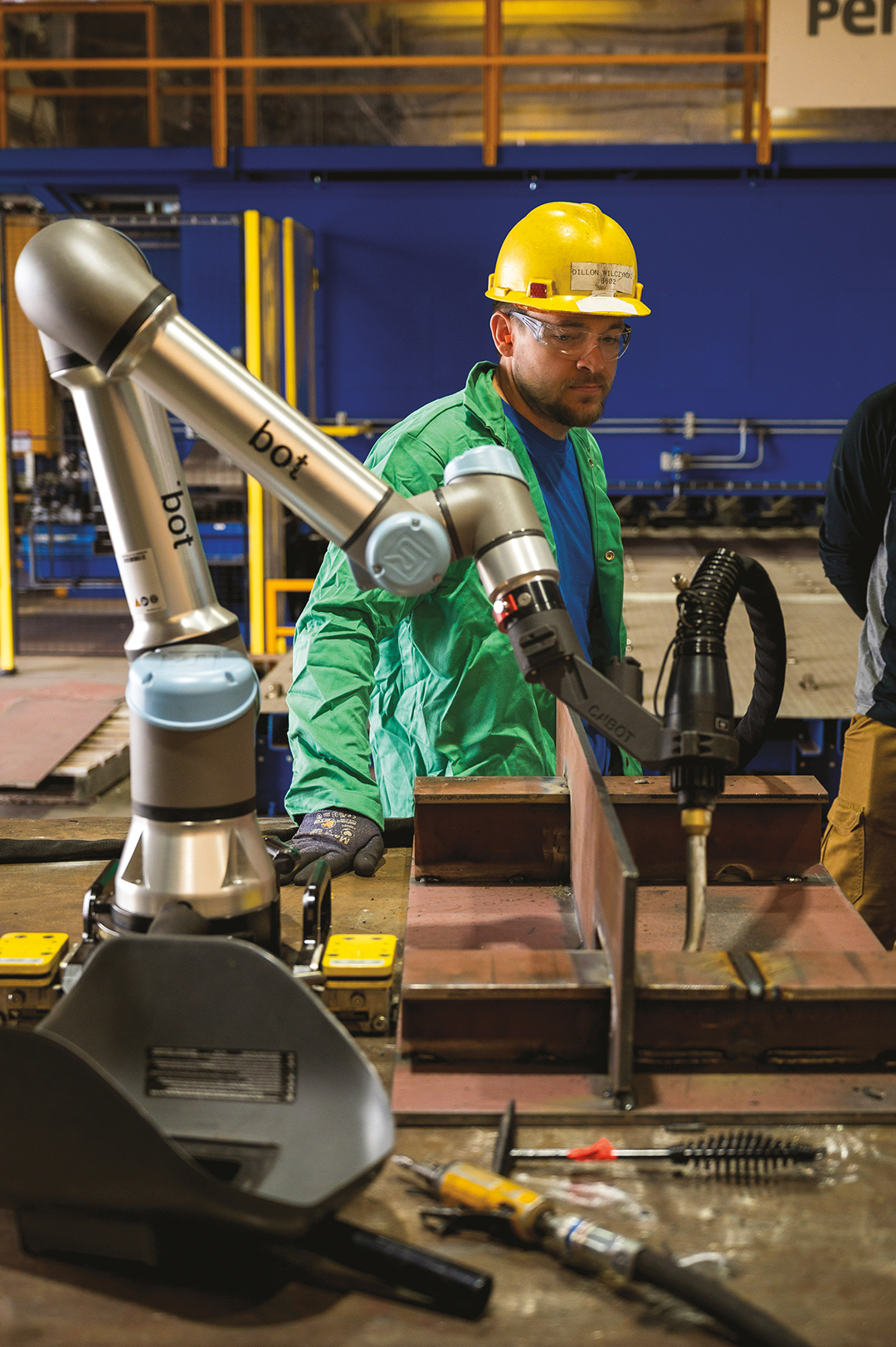 “At first glance you can see why folks would assume [cobots] were going to replace the welder,” Chief of Shipyard Operations Rick Nutt says. “When in reality it allows a welder to use a tablet and not have their face or body in close proximity to the heat and smoke.”