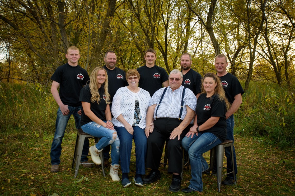 In back from left are Sam Heim, Jeremy Heim, Ben Heim, Scott Heim, and Rod Heim. In front, from left, are Kiley Heim, Joyce Heim, Lloyd Heim, and Carrie Heim.
