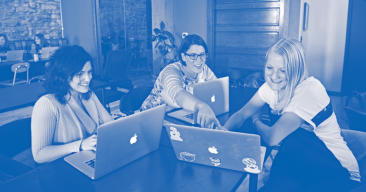 Blue Door Consulting team members, from left, Ann Timms, Leah Van Rooy and Kayla Johnson take part in a quarterly meeting at the company's Oshkosh headquarters.