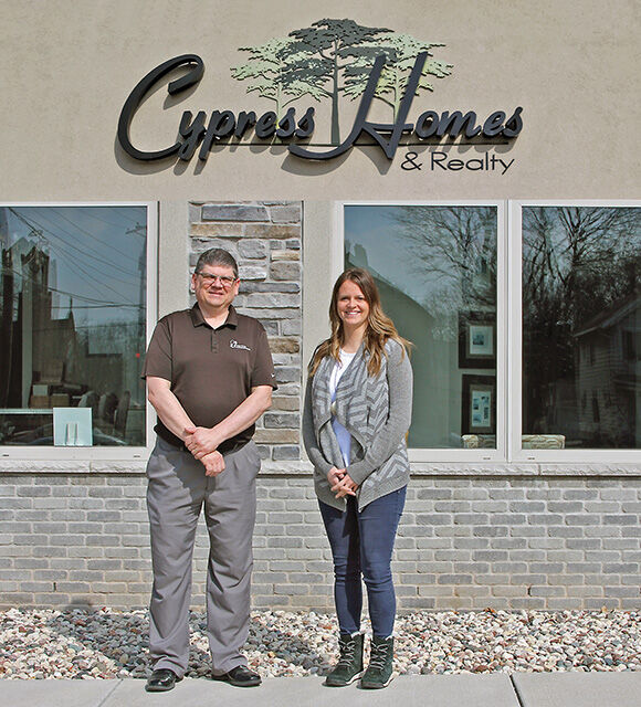 Jason Bloxham of Wolf River Community Bank, and Shannon Meyer, president and owner of Cypress Homes & Realty, have strengthened their partnership during the recent building boom.