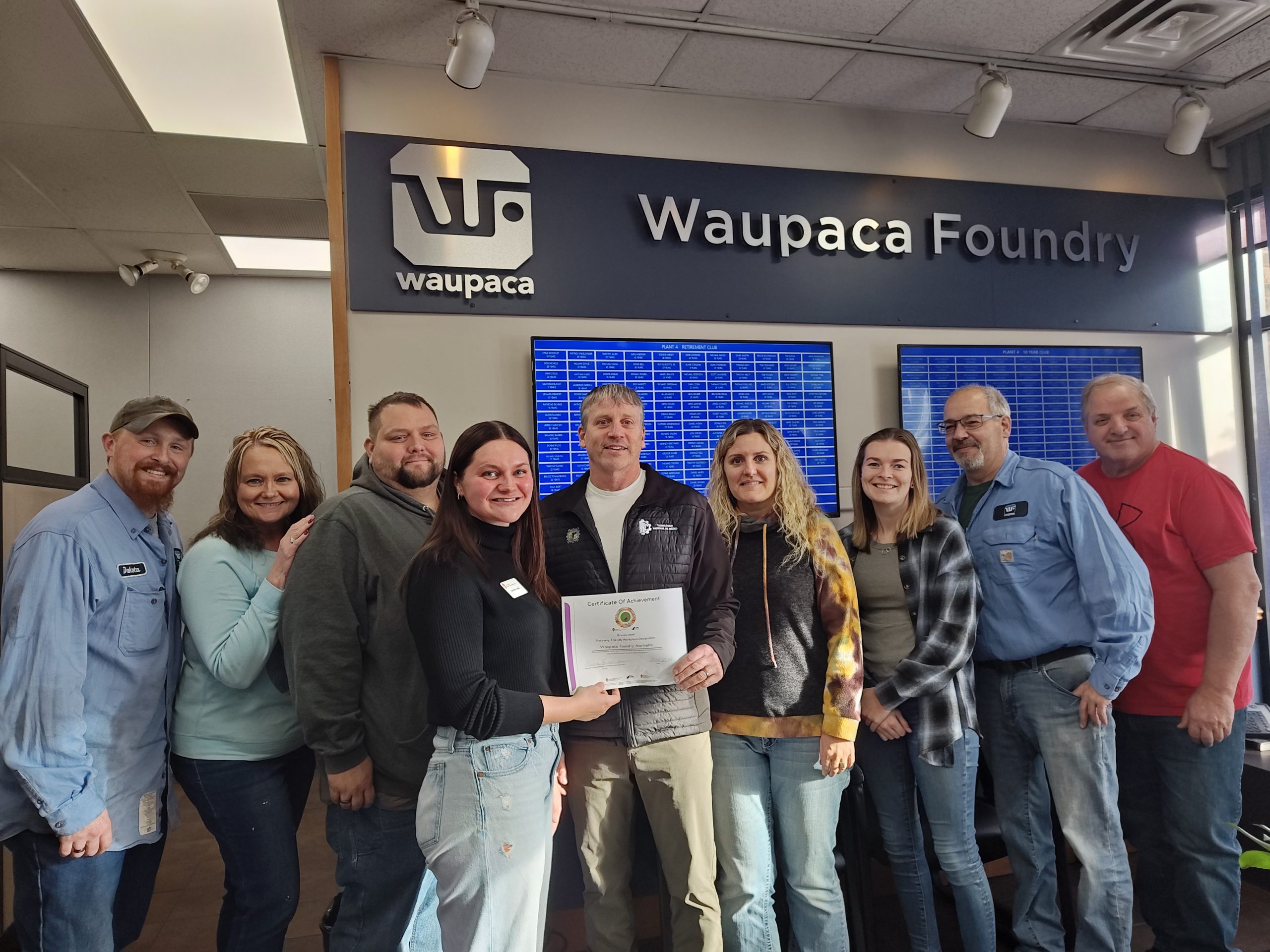 Pictured from left are Waupaca Foundry Marinette staff members Dakota Taylor, Peggy Peterson, Cory Haberland, Recovery Friendly Workplace Team member Danielle Lemke of UW Extension presenting RFW certification to Waupaca’s Phil Eatherton, Kim Staudenmaier, Kelsey McClain, Fred Gard, and Michael Paris.