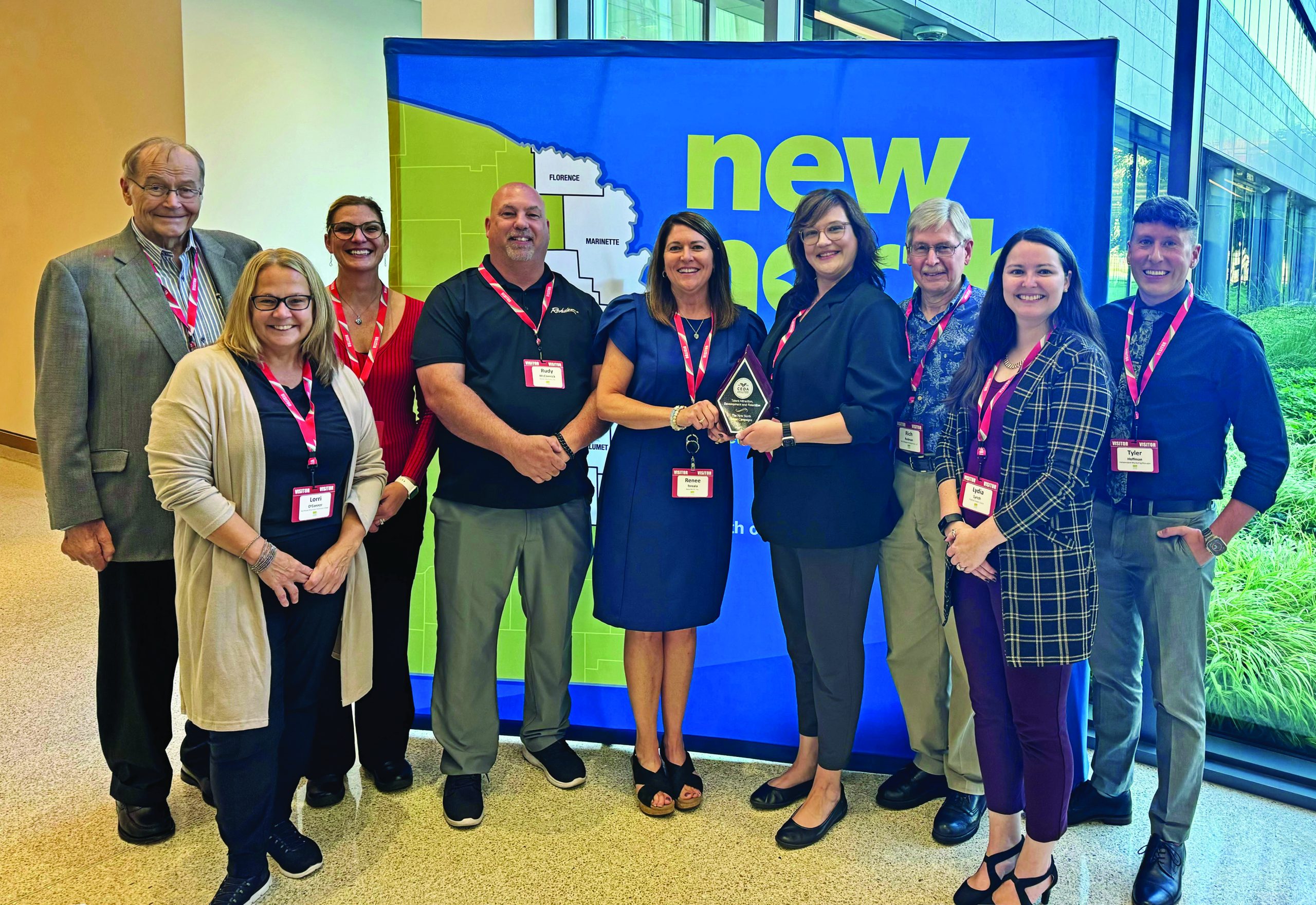 Members of the New North marketing and branding committee pose with their 2024 WEDA Award.