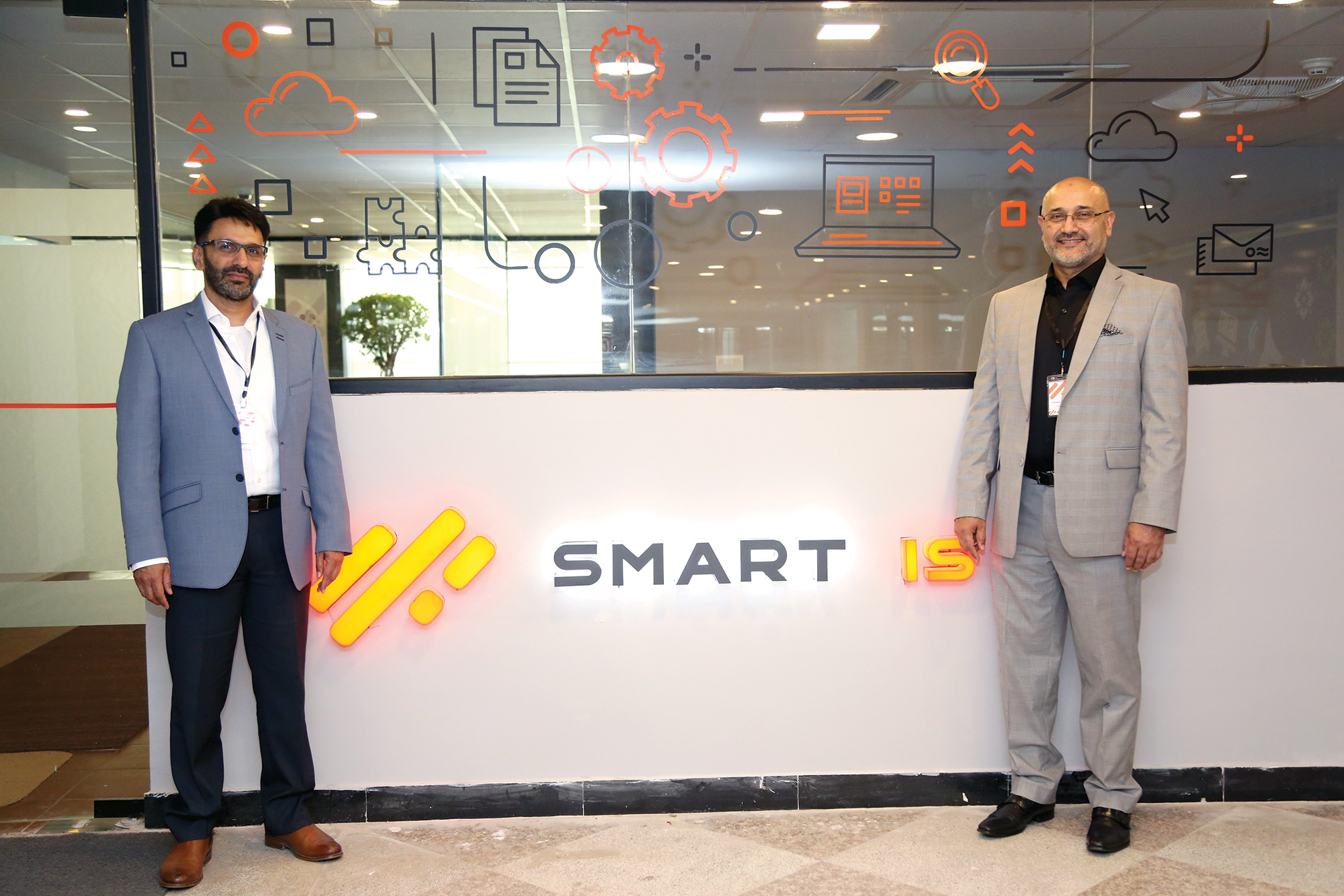 Javad Ahmad (L) and his two brothers, Khurram Ahmad (R) and Saad Ahmad, share ownership of Smart IS as equal partners.