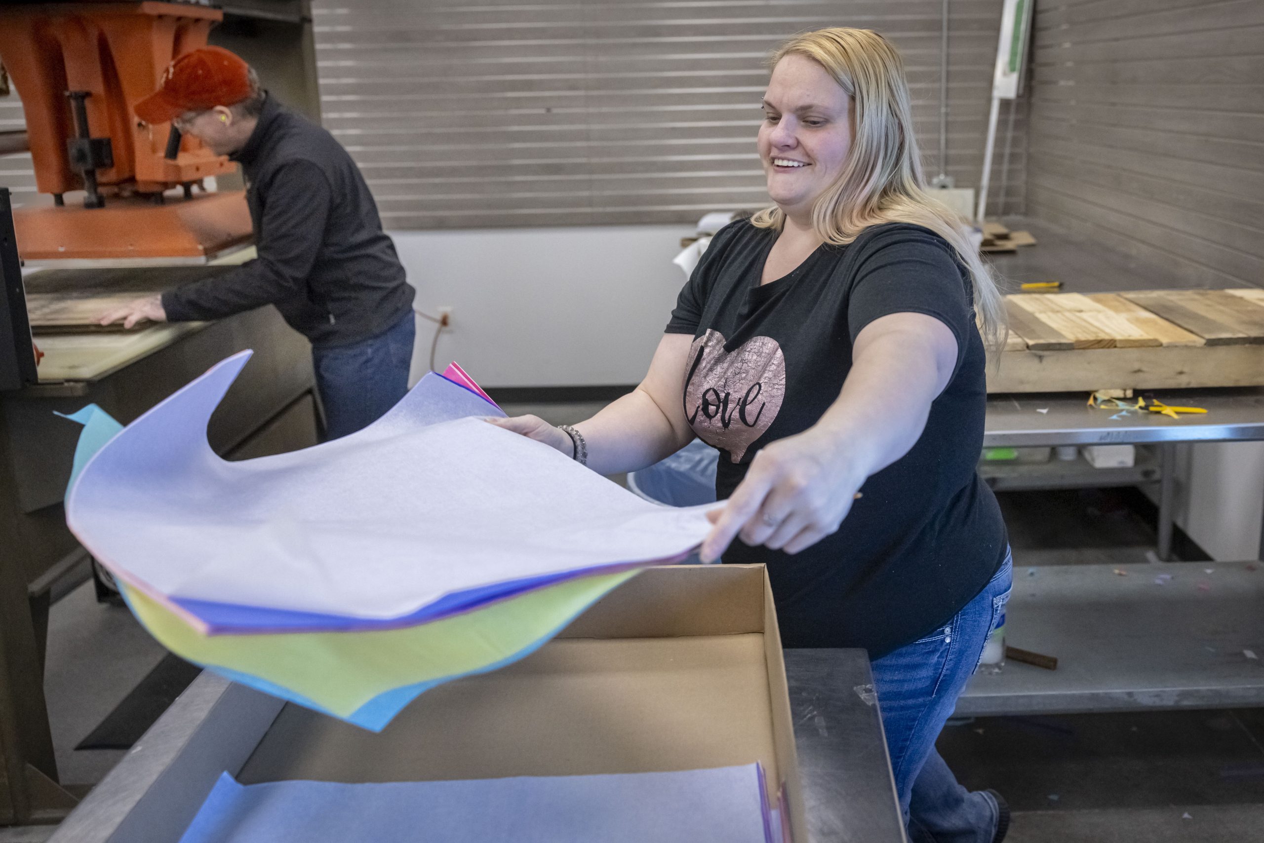 Mellisa Edwards, an employee at Apricity Contract Packaging in Appleton works on a project.