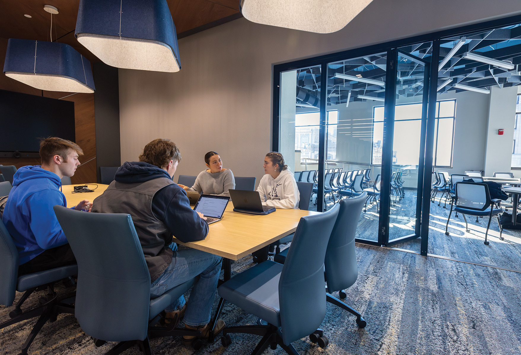 Students meet with Emma Snyder, Program Manager with Gener8tor, in the Business & Entrepreneur Center’s boardroom Nov. 7, 2024. Photo by Danny Damiani