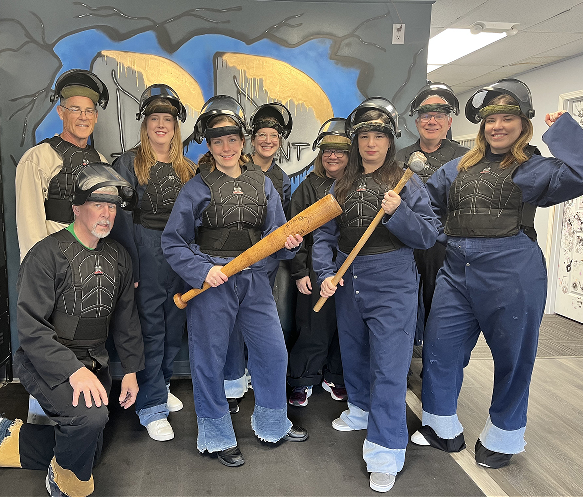Insight Publications having some fun and bonding this spring in Appleton at The Breaking Point LLC's rage room.