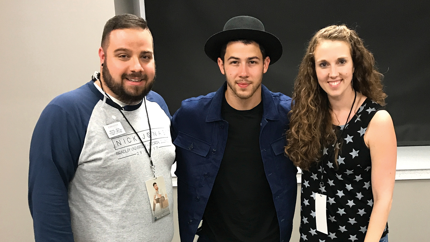Jolene Chevalier (right) with Nick Jonas (center), whom she booked to perform at Bradley University in Peoria, Illinois Sept. 30, 2017.