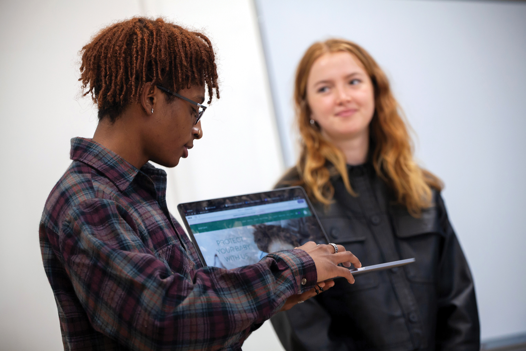 Lawrence University student Chrision Wynaar takes part in a group presentation during an Innovation and Entrepreneurship class.