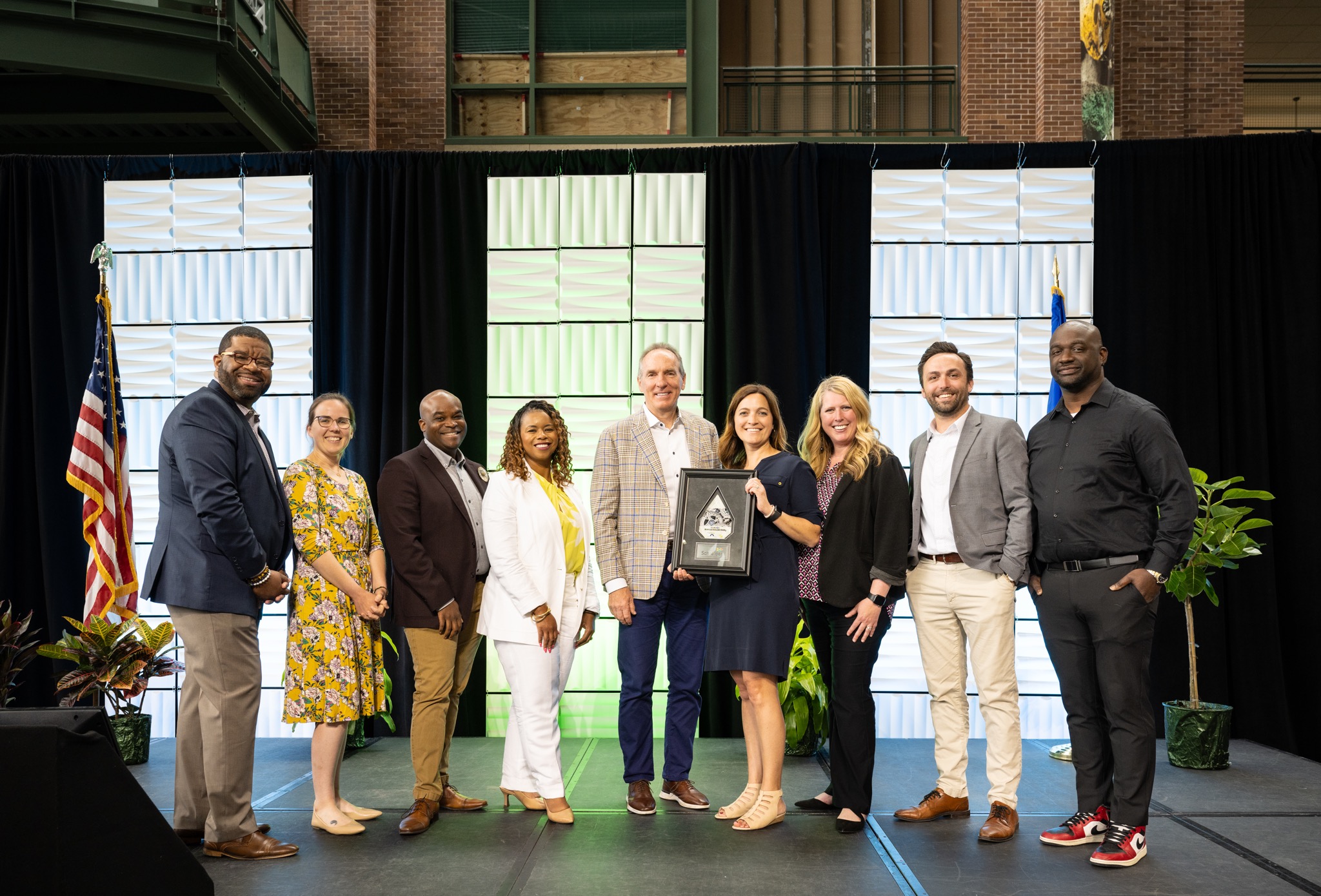 Schreiber Foods received the 2024 New North Workplace Excellence Award. From left, are DJ Daniels, Heather Milbach, Michael Vinson, Jenene Calloway, Ron Dunford, Erin Hughes, Christine Ness, Adams Robillard, and Randy Jones,