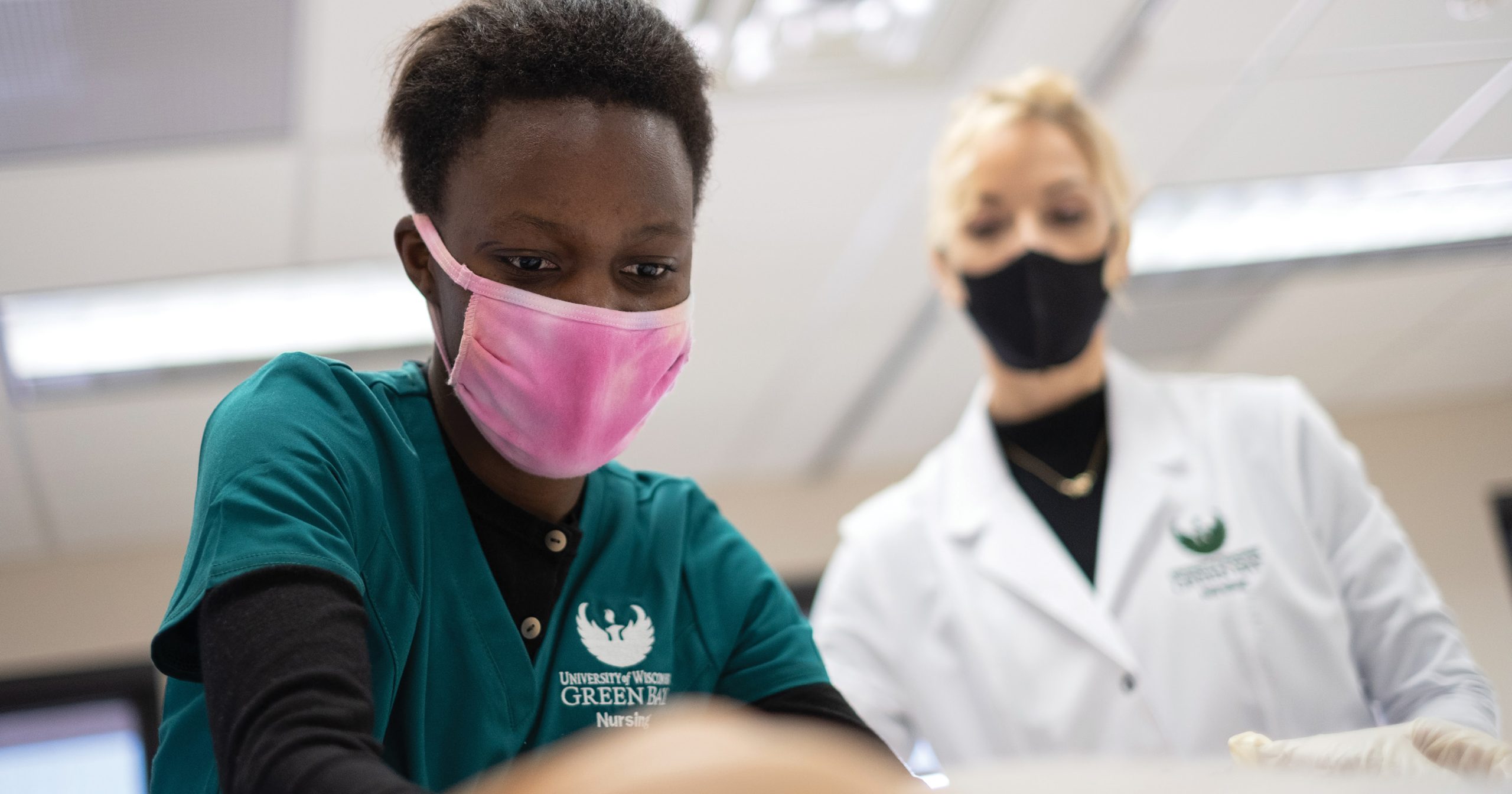 UW-Green Bay strives to respond to the needs of the community, including helping meet the demand for more nurses. Here, nursing students work in a simulator lab classroom in Wood Hall.