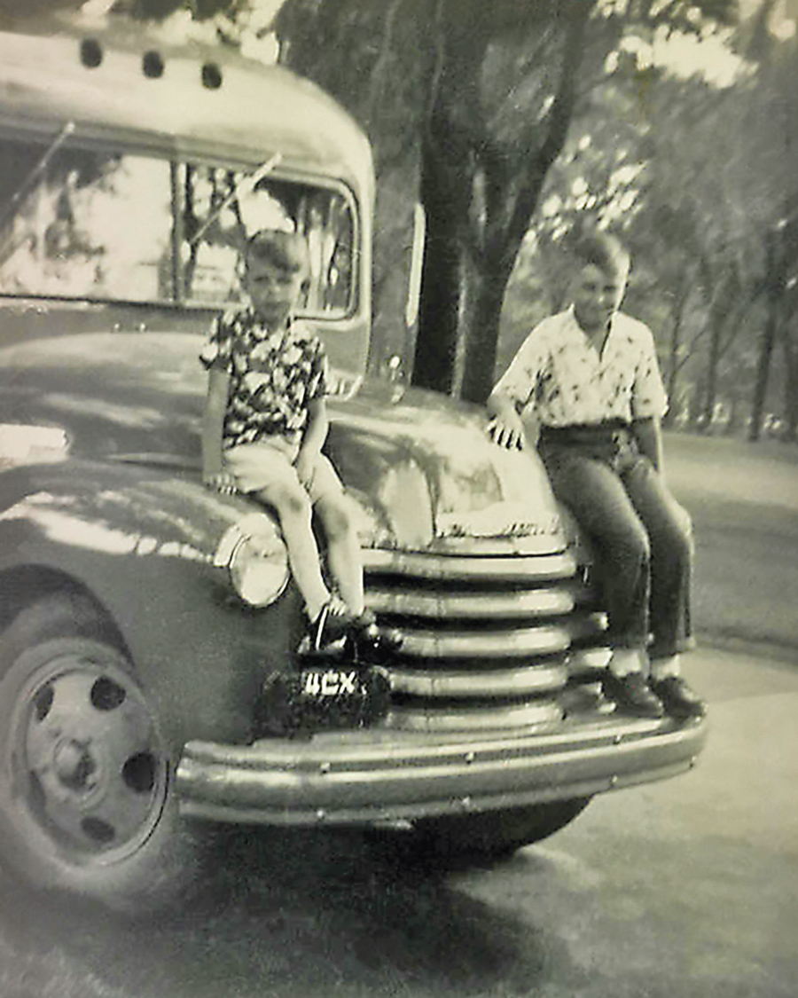 Photo of one of the original red, white and blue school bus with founders, circa 1938/1939
