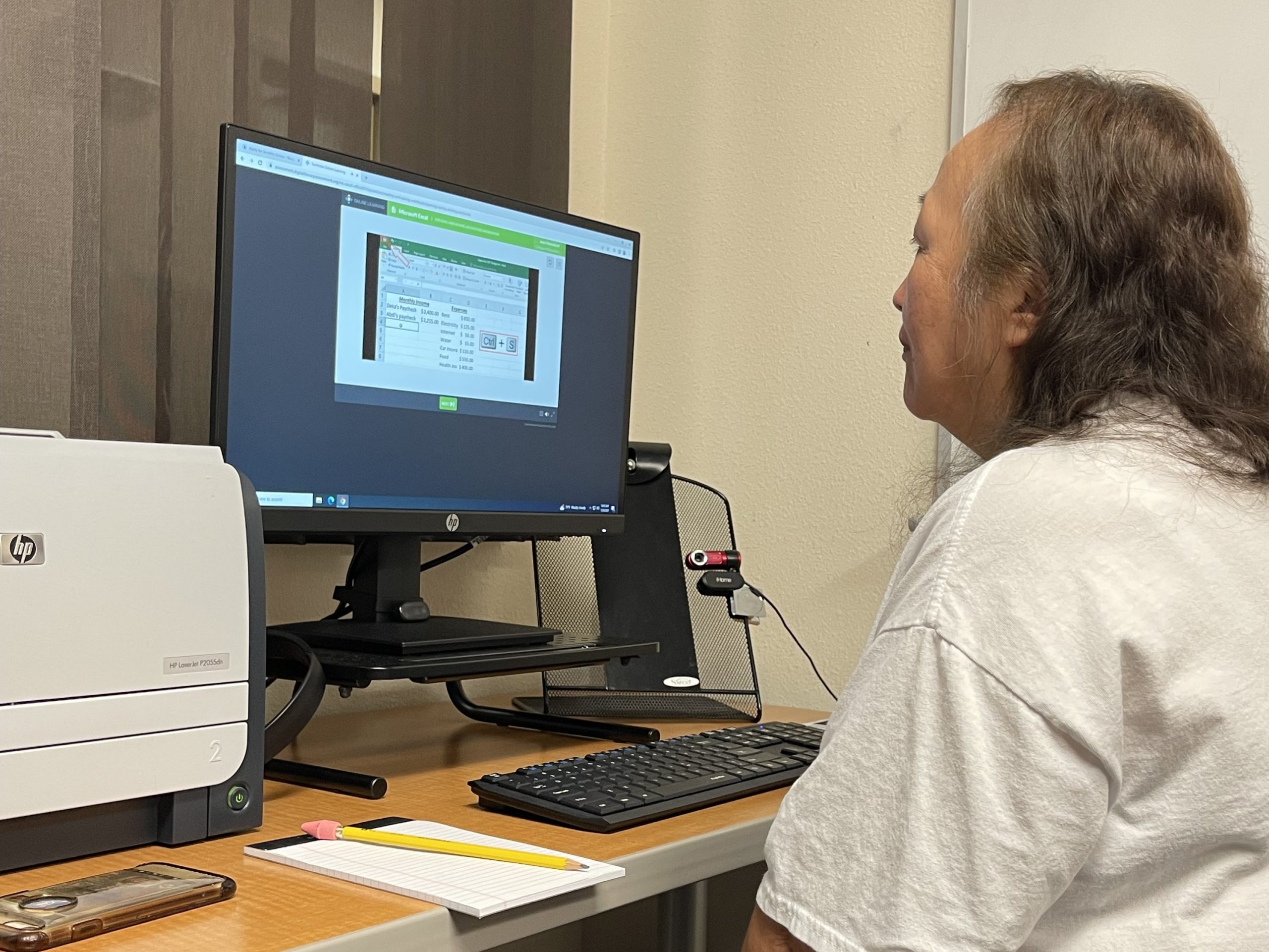 Joyce Pamonicutt works at a computer at College of Menomunee as part of the NEW BOOST for Hidden Talent program July 26, 2023.