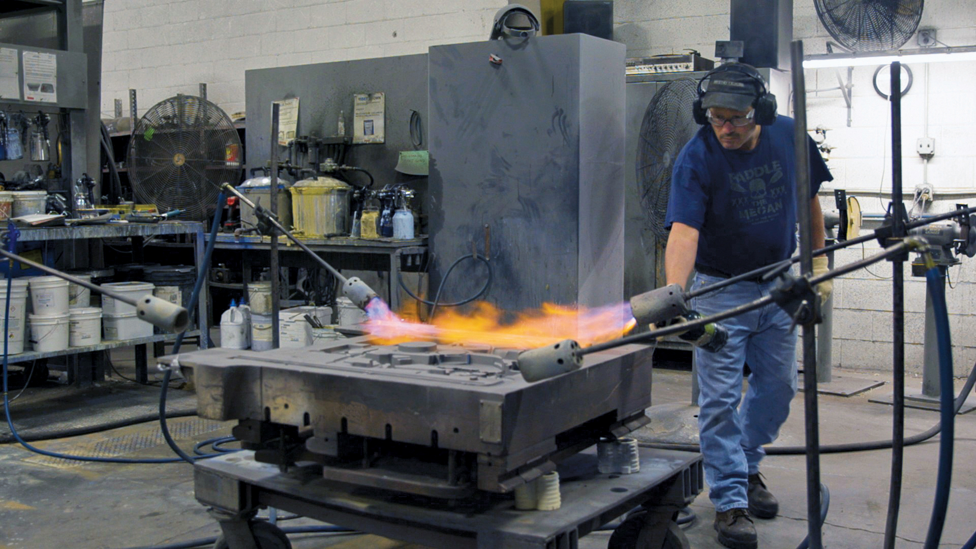 Heating a permanent mold die for repainting in preparation for future castings at WAF.