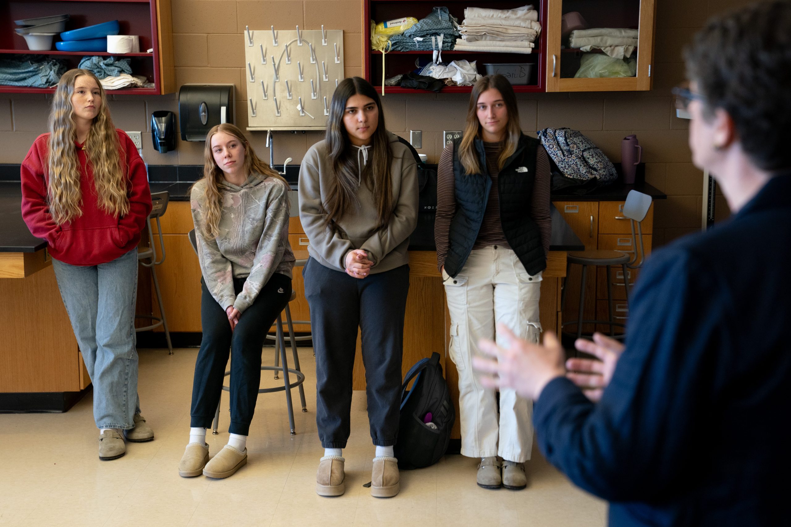 Certified nursing assistant students speak with Wisconsin Superintendent of Public Instruction Jill Underly during a tour of Northwestern High School’s career and technical education program on Feb. 25, 2026, in Maple, Wis. (Erica Dischino for Wisconsin Watch)