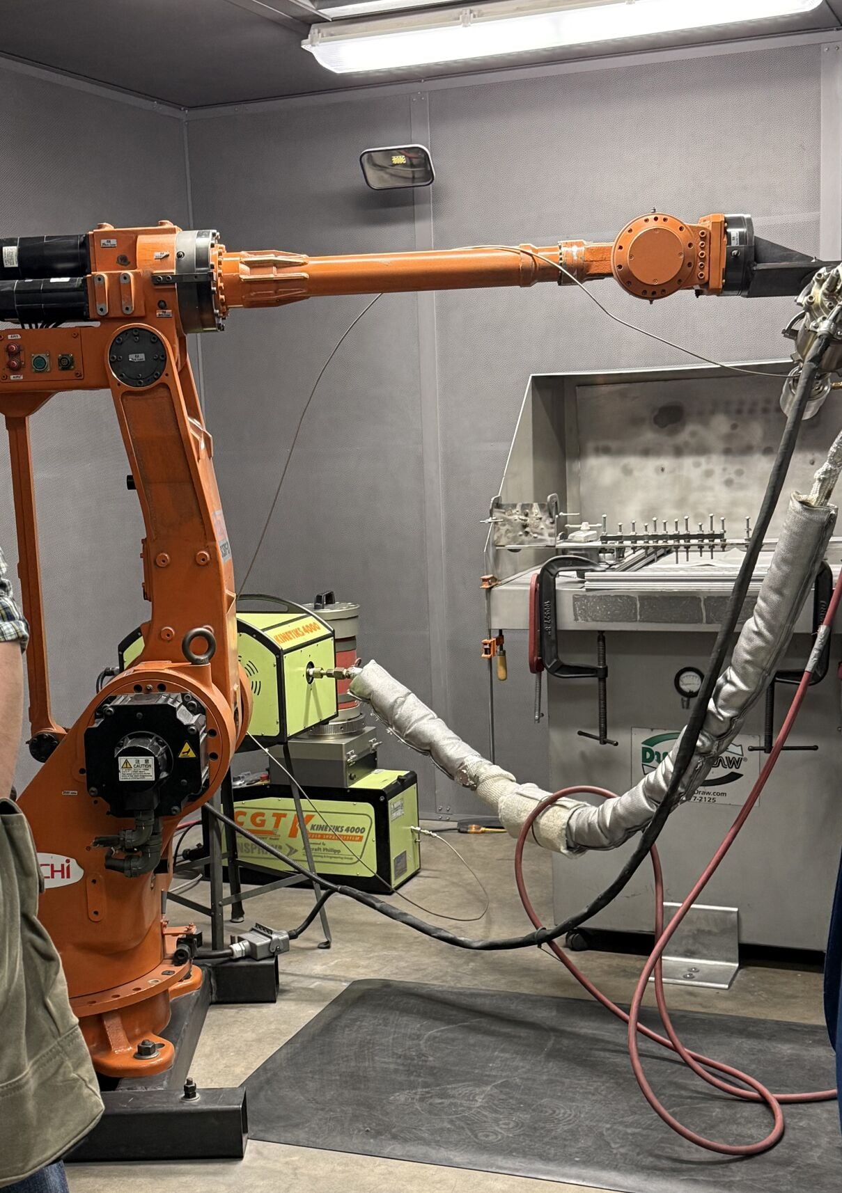 Some summit attendees toured labs, like UW-Madison's Cold Spray Lab, focused on manufacturing metal coatings (with devices like the one above) for fusion devices that can better resist their extreme conditions.